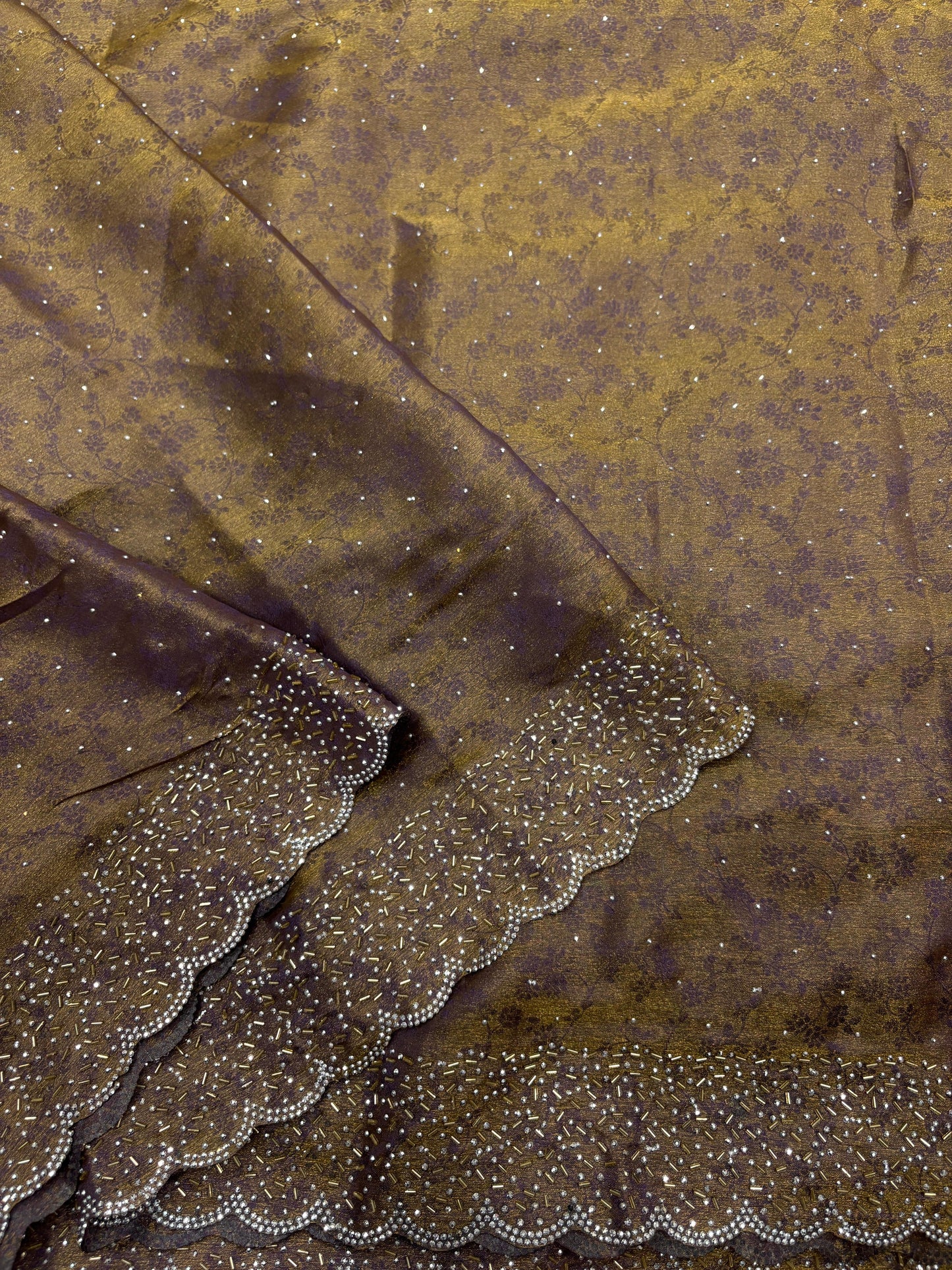 Fandy satin saree with self weaving zari pattern in body with all over siroski border and running blouse with siroski bord