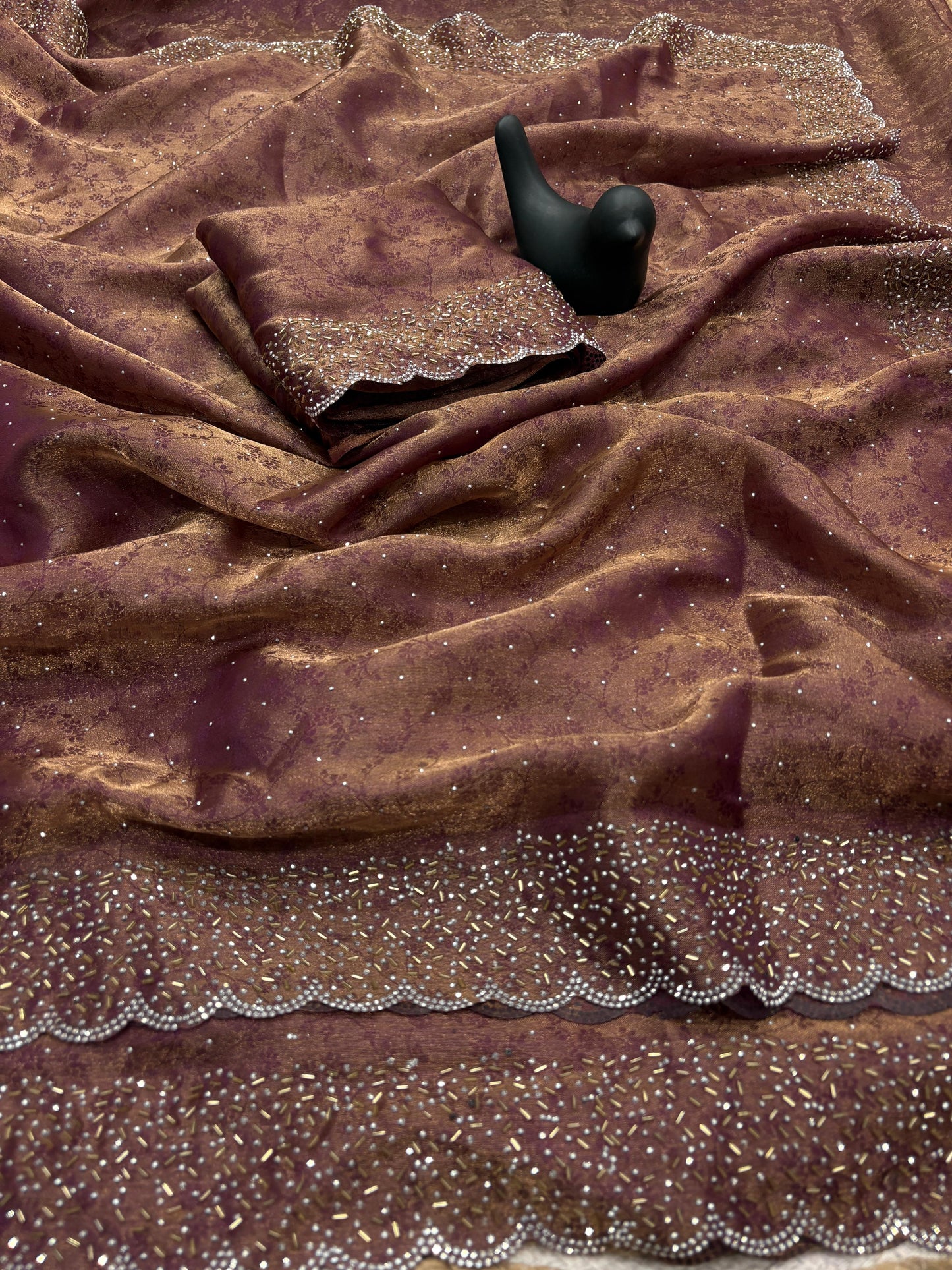 Fandy satin saree with self weaving zari pattern in body with all over siroski border and running blouse with siroski bord